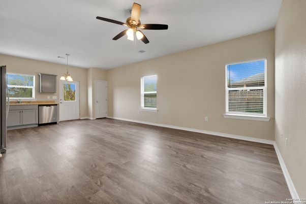 Empty room, Interior, Kitchen, Pendant Lights, Stainless Steel Appliances, Wood Texture Flooring