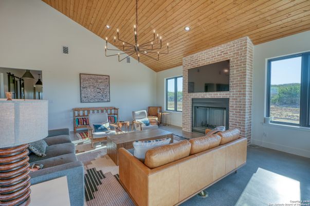 Fireplace, Interior, Living room, Pendant Lights, Recessed Lighting, Stone Walls, Wooden Ceilings
