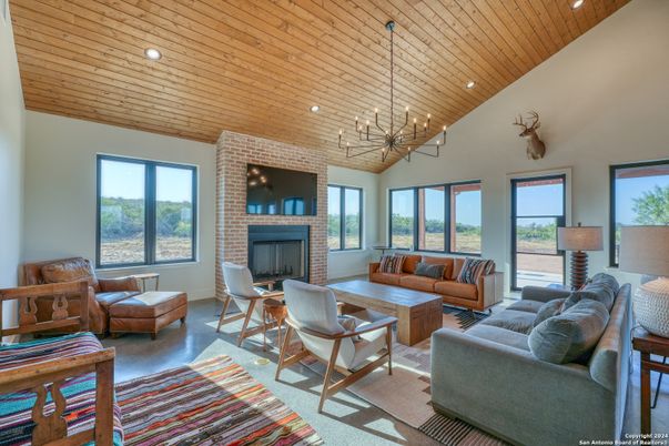 Fireplace, Interior, Living room, Pendant Lights, Recessed Lighting, Stone Walls, Wooden Ceilings