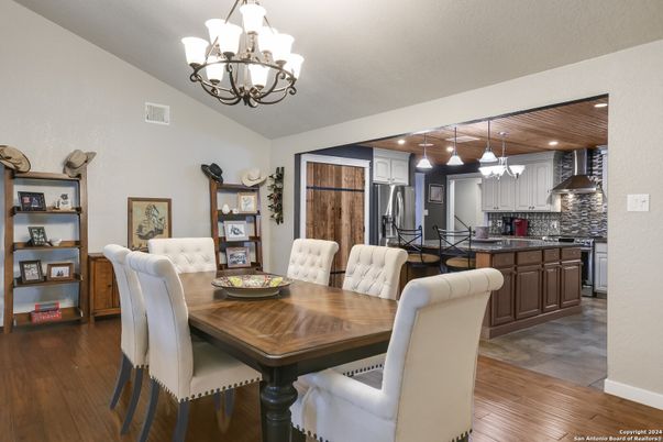 Chandelier, Dining room, Interior, Kitchen, Pendant Lights, Recessed Lighting, Stainless Steel Appliances, Wood Texture Flooring