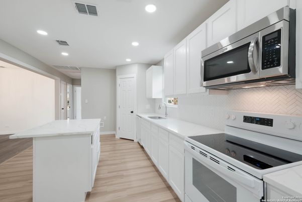 Interior, Kitchen, Recessed Lighting, Stainless Steel Appliances, Wood Texture Flooring