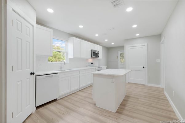 Interior, Kitchen, Recessed Lighting, Stainless Steel Appliances, Wood Texture Flooring