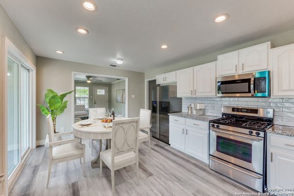 Dining room, Interior, Kitchen, Recessed Lighting, Stainless Steel Appliances, Wood Texture Flooring