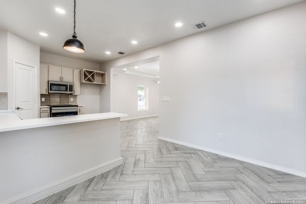 Interior, Kitchen, Pendant Lights, Recessed Lighting, Stainless Steel Appliances, Wood Texture Flooring