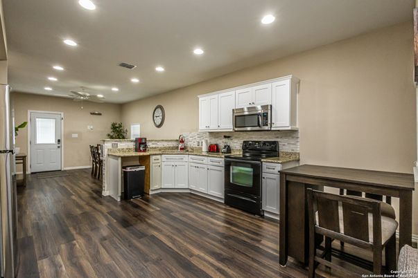 Dining room, Interior, Kitchen, Recessed Lighting, Stainless Steel Appliances, Wood Texture Flooring