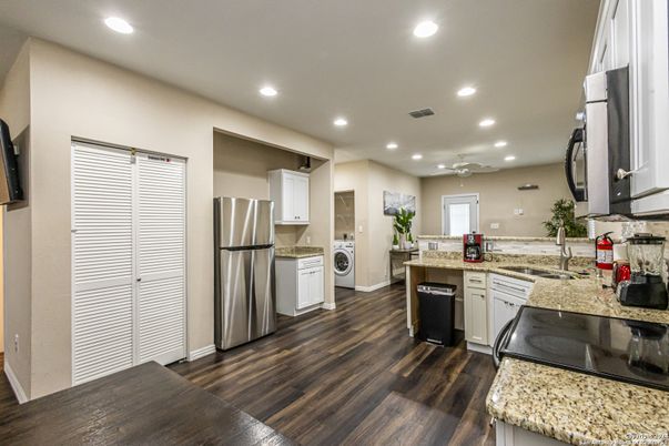 Interior, Kitchen, Recessed Lighting, Stainless Steel Appliances, Washer, Wood Texture Flooring