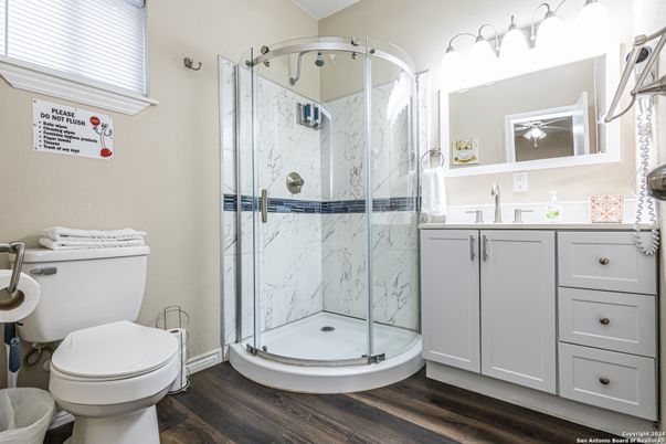 Bathroom, Glass Shower, Interior, Marble Walls, Wood Texture Flooring
