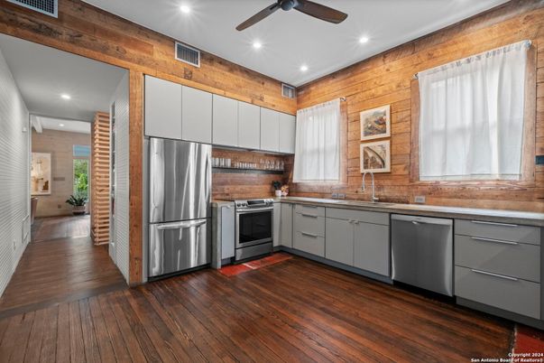 Interior, Kitchen, Recessed Lighting, Stainless Steel Appliances, Wood Texture Flooring, Wooden Walls