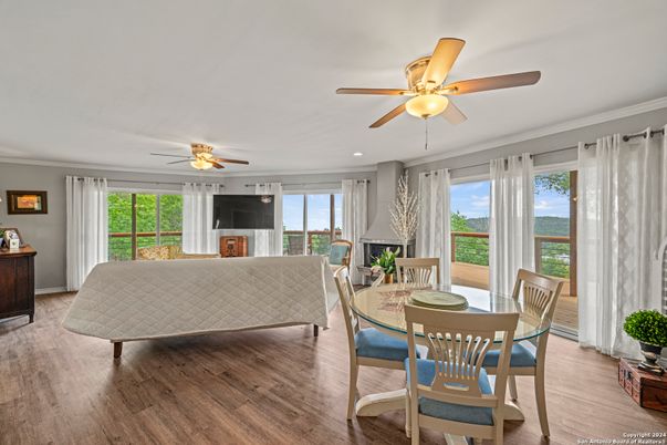 Dining room, Fireplace, Interior, Living room, Recessed Lighting, Wood Texture Flooring