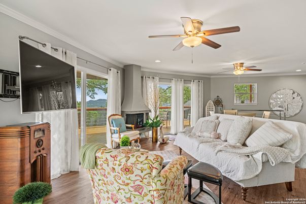 Dining room, Fireplace, Interior, Living room, Recessed Lighting, Wood Texture Flooring