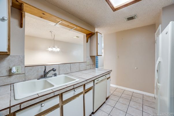 Interior, Kitchen, Recessed Lighting, Tile Countertops