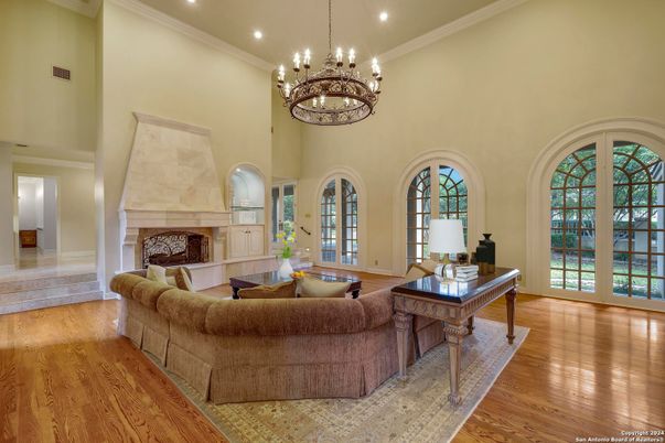 Chandelier, Fireplace, Interior, Living room, Recessed Lighting, Wood Texture Flooring