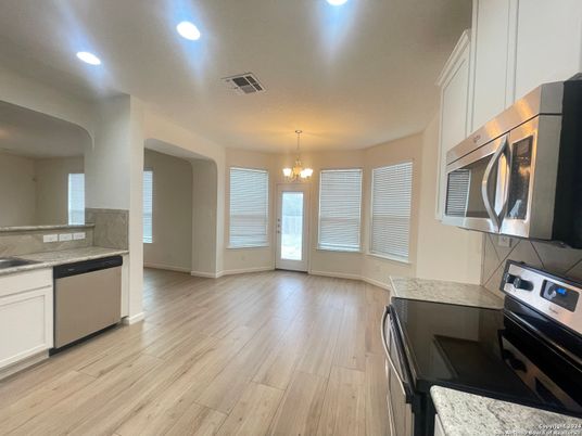 Chandelier, Interior, Kitchen, Recessed Lighting, Stainless Steel Appliances, Wood Texture Flooring