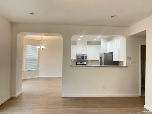Chandelier, Interior, Kitchen, Recessed Lighting, Stainless Steel Appliances, Wood Texture Flooring