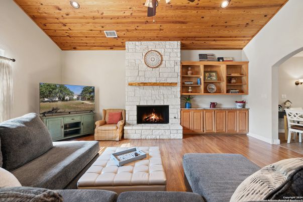 Fireplace, Interior, Living room, Recessed Lighting, Stone Walls, Wooden Ceilings, Wood Texture Flooring