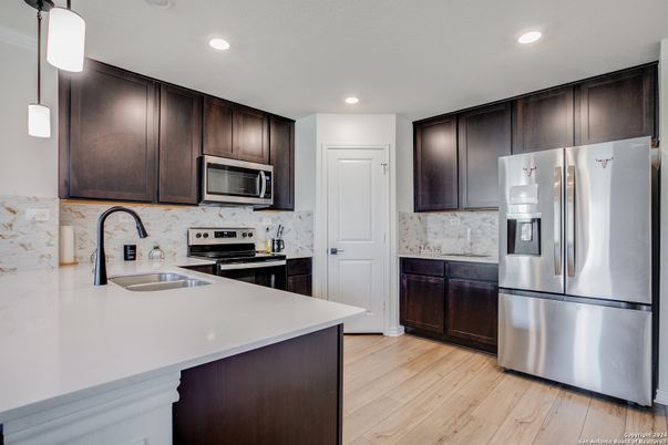 Interior, Kitchen, Pendant Lights, Recessed Lighting, Stainless Steel Appliances, Wood Texture Flooring