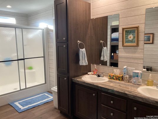 Bathroom, Dual Sink Vanities, Glass Shower, Interior, Recessed Lighting, Wood Texture Flooring