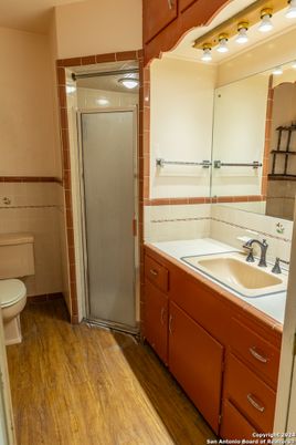 Bathroom, Glass Shower, Interior, Tile Countertops, Wood Texture Flooring