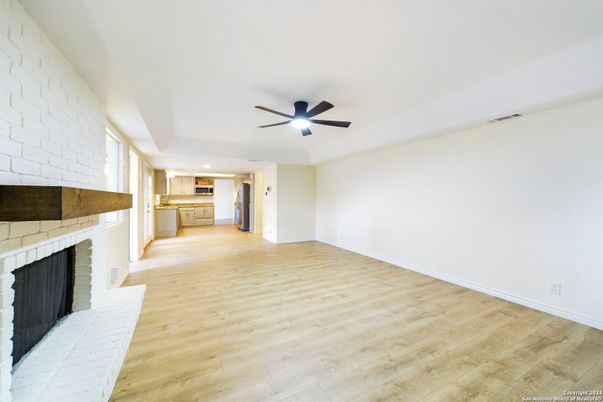 Empty room, Fireplace, Interior, Kitchen, Recessed Lighting, Wood Texture Flooring