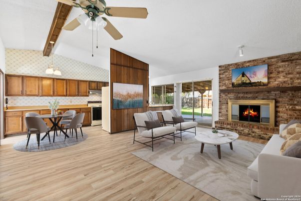 Dining room, Fireplace, Interior, Kitchen, Living room, Pendant Lights, Stainless Steel Appliances, Stone Walls, Wood Texture Flooring