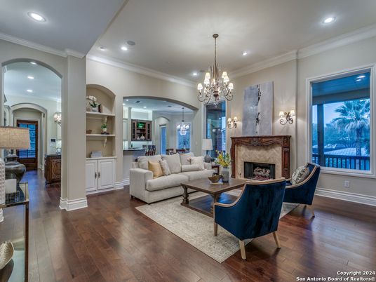 Chandelier, Fireplace, Interior, Living room, Pendant Lights, Recessed Lighting, Wood Texture Flooring