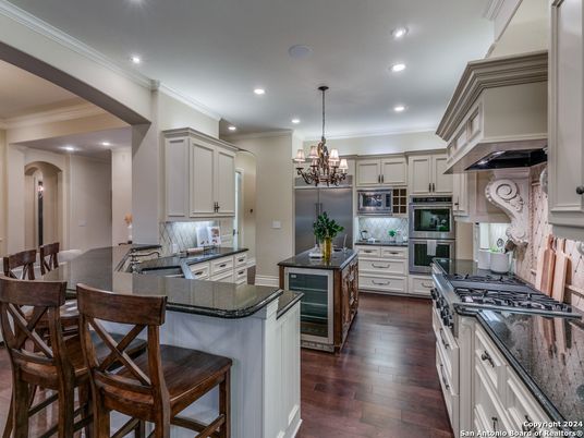 Chandelier, Interior, Kitchen, Recessed Lighting, Stainless Steel Appliances, Wood Texture Flooring