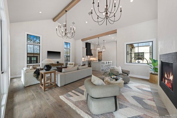 Chandelier, Fireplace, Interior, Kitchen, Living room, Pendant Lights, Recessed Lighting, Wooden Beams, Wood Texture Flooring
