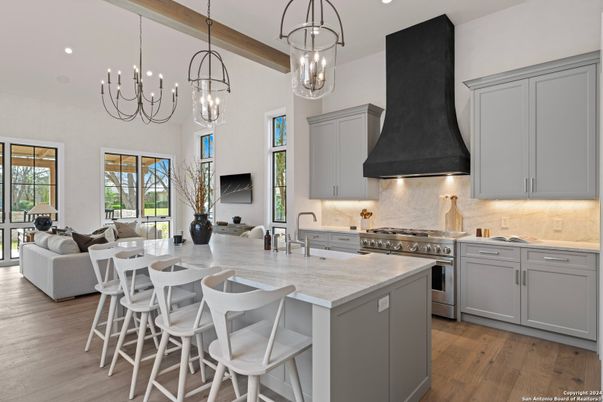 Chandelier, Interior, Kitchen, Living room, Pendant Lights, Recessed Lighting, Stainless Steel Appliances, Wood Texture Flooring