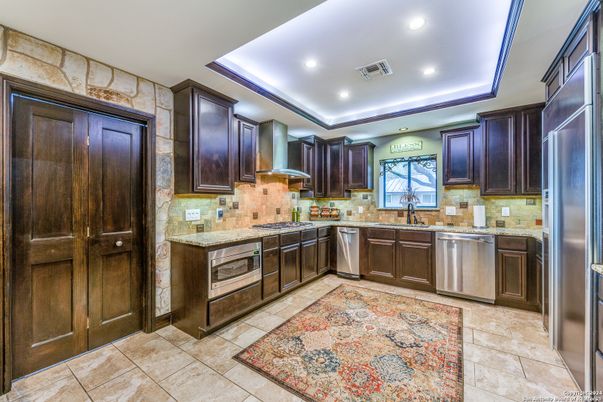 Interior, Kitchen, Recessed Lighting, Stainless Steel Appliances, Stone Walls