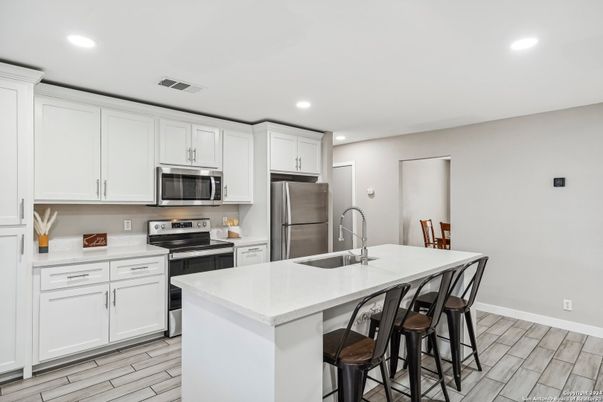 Interior, Kitchen, Recessed Lighting, Stainless Steel Appliances, Wood Texture Flooring