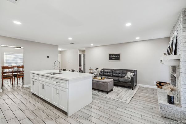 Dining room, Fireplace, Interior, Kitchen, Living room, Recessed Lighting, Wood Texture Flooring