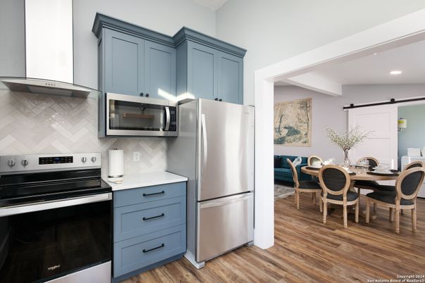 Dining room, Interior, Kitchen, Recessed Lighting, Stainless Steel Appliances, Wood Texture Flooring