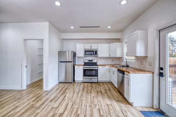 Interior, Kitchen, Recessed Lighting, Stainless Steel Appliances, Wood Texture Flooring