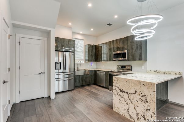 Interior, Kitchen, Pendant Lights, Recessed Lighting, Stainless Steel Appliances, Wood Texture Flooring