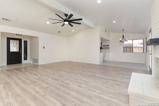 Chandelier, Empty room, Fireplace, Interior, Recessed Lighting, Wood Texture Flooring