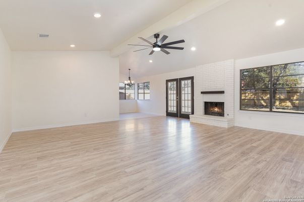 Chandelier, Empty room, Fireplace, Interior, Recessed Lighting, Wood Texture Flooring