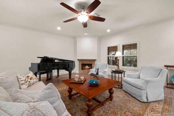 Fireplace, Interior, Living room, Piano, Recessed Lighting, Wood Texture Flooring