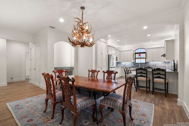 Chandelier, Dining room, Interior, Kitchen, Recessed Lighting, Stainless Steel Appliances, Wood Texture Flooring