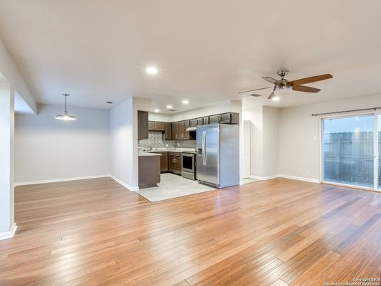 Empty room, Interior, Kitchen, Recessed Lighting, Stainless Steel Appliances, Wood Texture Flooring