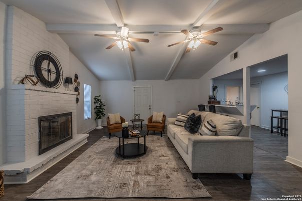Fireplace, Interior, Living room, Recessed Lighting, Stone Walls, Wood Texture Flooring