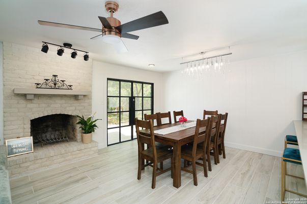 Dining room, Fireplace, Interior, Pendant Lights, Recessed Lighting, Stone Walls, Wood Texture Flooring