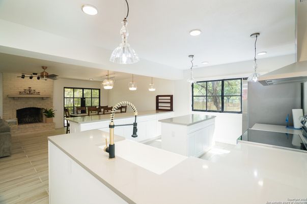 Fireplace, Interior, Kitchen, Pendant Lights, Recessed Lighting, Stone Walls, Wood Texture Flooring