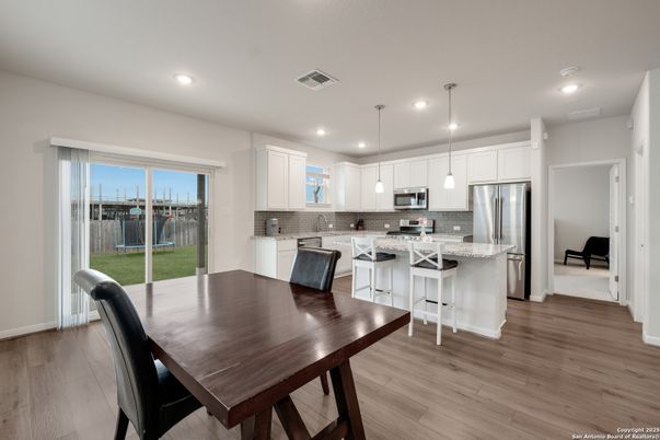 Dining room, Interior, Kitchen, Pendant Lights, Recessed Lighting, Stainless Steel Appliances, Wood Texture Flooring