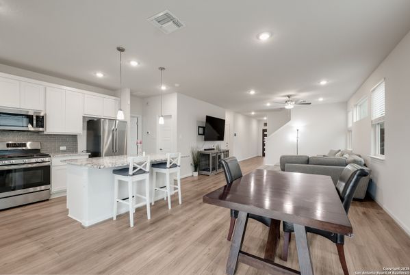 Dining room, Interior, Kitchen, Pendant Lights, Recessed Lighting, Stainless Steel Appliances, Wood Texture Flooring