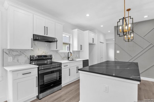 Interior, Kitchen, Marble Walls, Pendant Lights, Recessed Lighting, Stainless Steel Appliances, Wood Texture Flooring