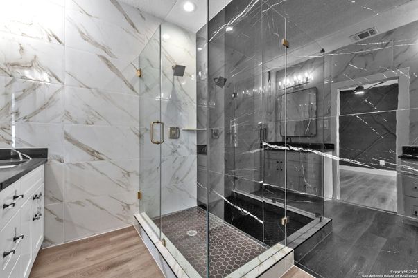 Bathroom, Glass Shower, Interior, Marble Walls, Recessed Lighting, Wood Texture Flooring
