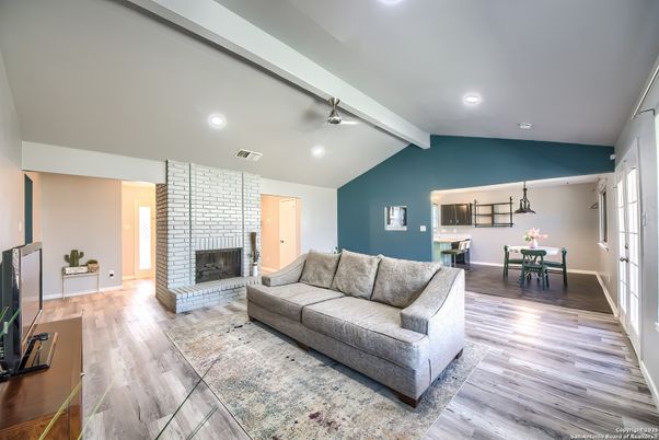 Dining room, Fireplace, Interior, Living room, Pendant Lights, Recessed Lighting, Wood Texture Flooring