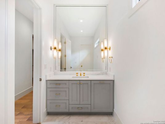 Bathroom, Dual Sink Vanities, Interior, Marble, Recessed Lighting, Wood Texture Flooring