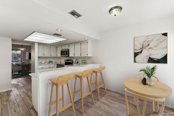Dining room, Interior, Kitchen, Recessed Lighting, Stainless Steel Appliances, Wood Texture Flooring