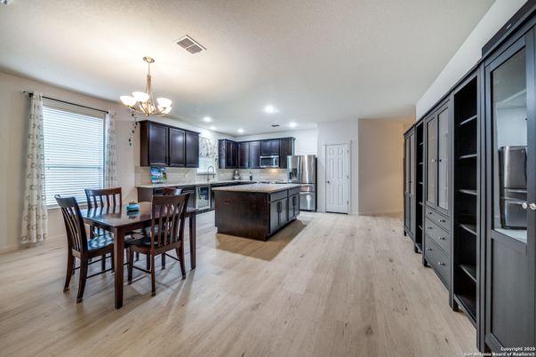 Chandelier, Dining room, Interior, Kitchen, Recessed Lighting, Stainless Steel Appliances, Wood Texture Flooring